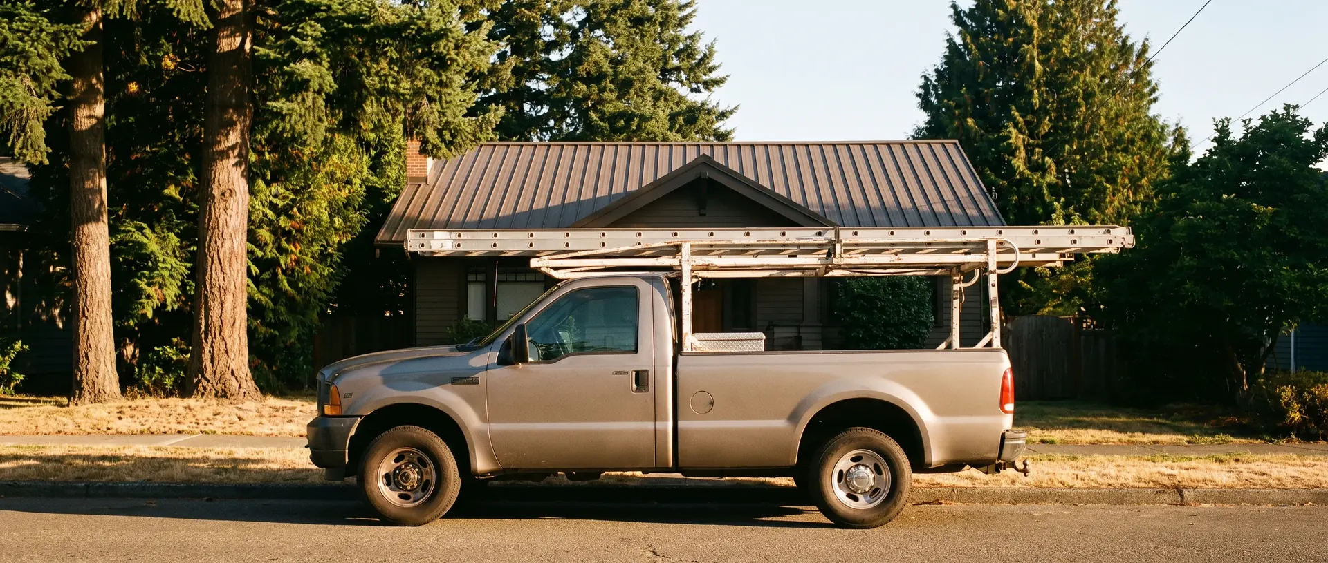 Work truck with a racked ladder parked outside a Bellingham home
